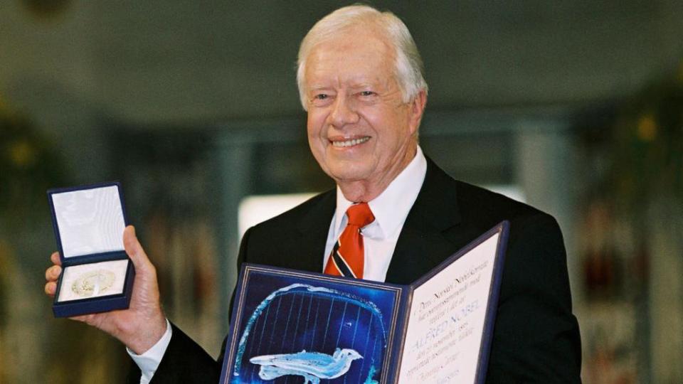 Biden and Trump lead tributes to 'extraordinary' Jimmy Carter after death