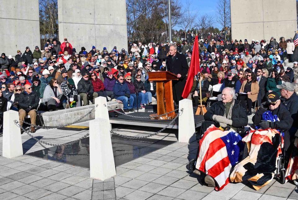 Volunteers place wreaths on graves at Indiantown Gap Cemetery