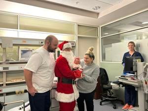 MultiCare NICU babies celebrate first Christmas with Santa visit and stockings. | News