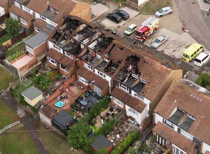 Work begins to remove asbestos-contaminated waste from homes in Rose Street, Northfleet, after fire