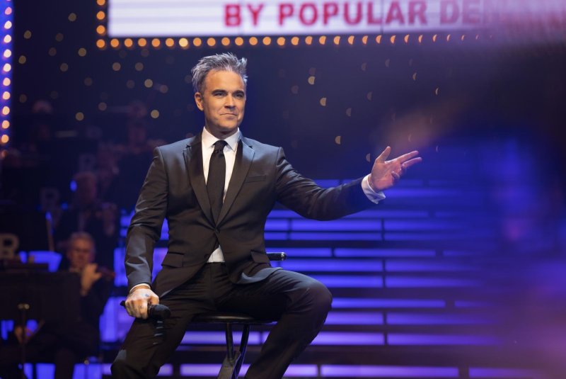 Movie review: 'Better Man' upends biopic with Robbie Williams charm