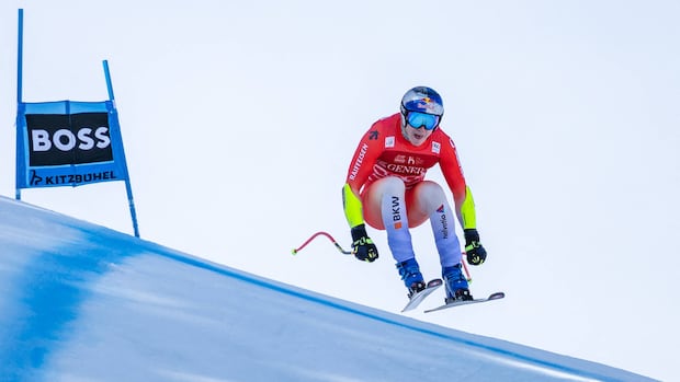 Swiss skier Marco Odermatt takes eventful World Cup super-G for 1st win in Kitzbuhel