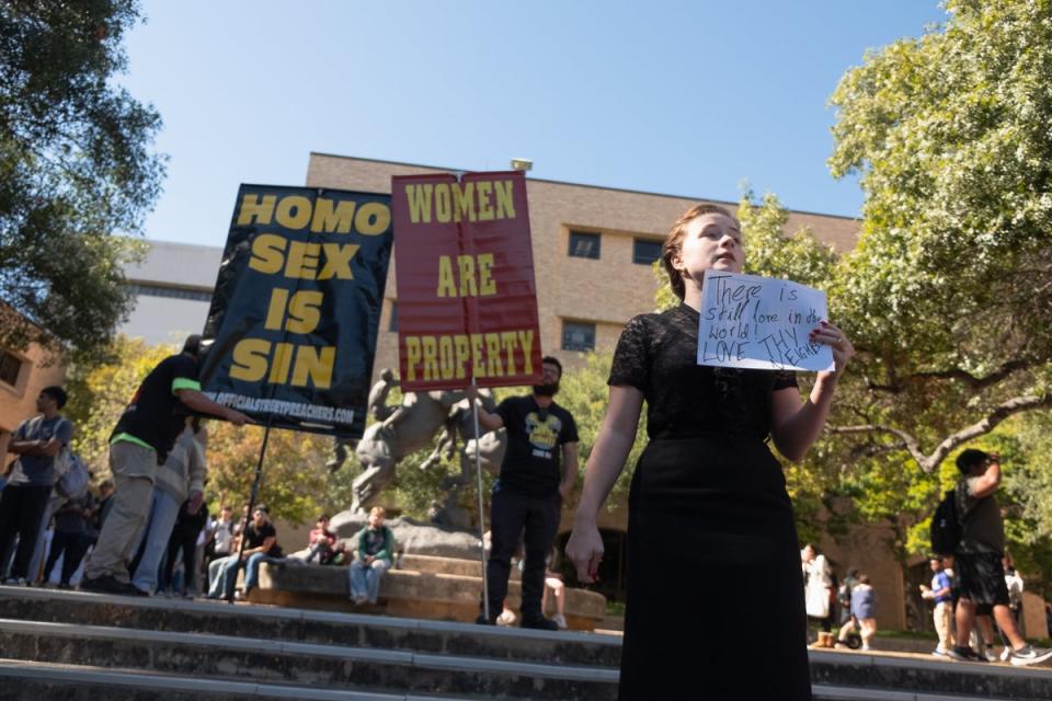 Texas campus in uproar after protesters hold signs declaring ‘women are property’ on quad after Trump victory