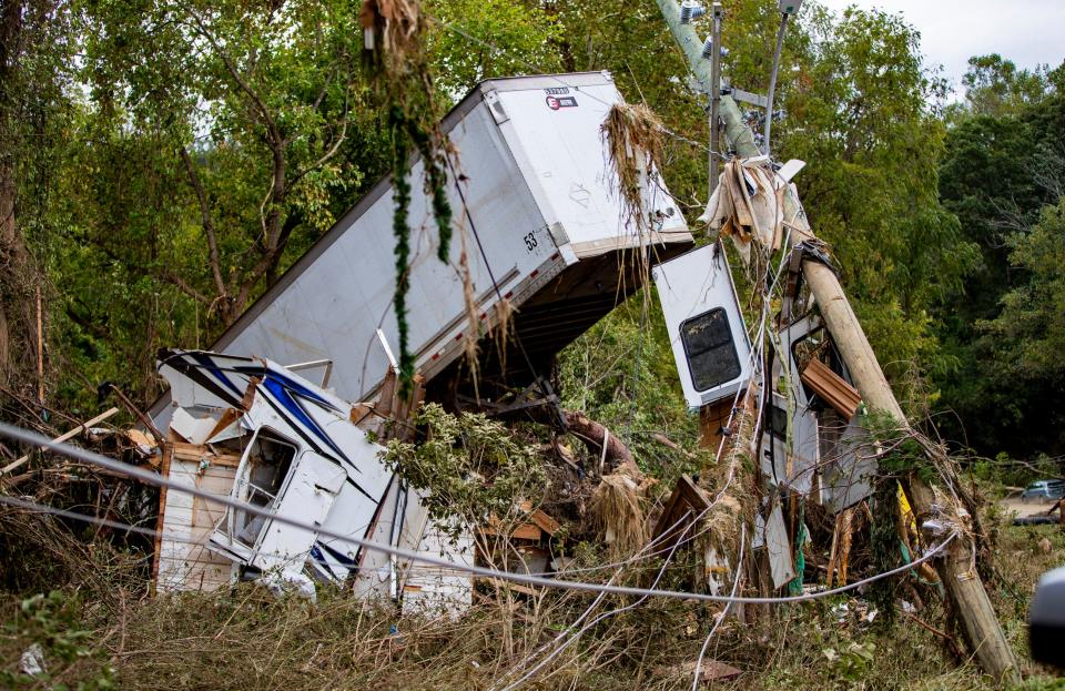 Isolated from the world, Asheville residents scavenge for food amid Helene floods