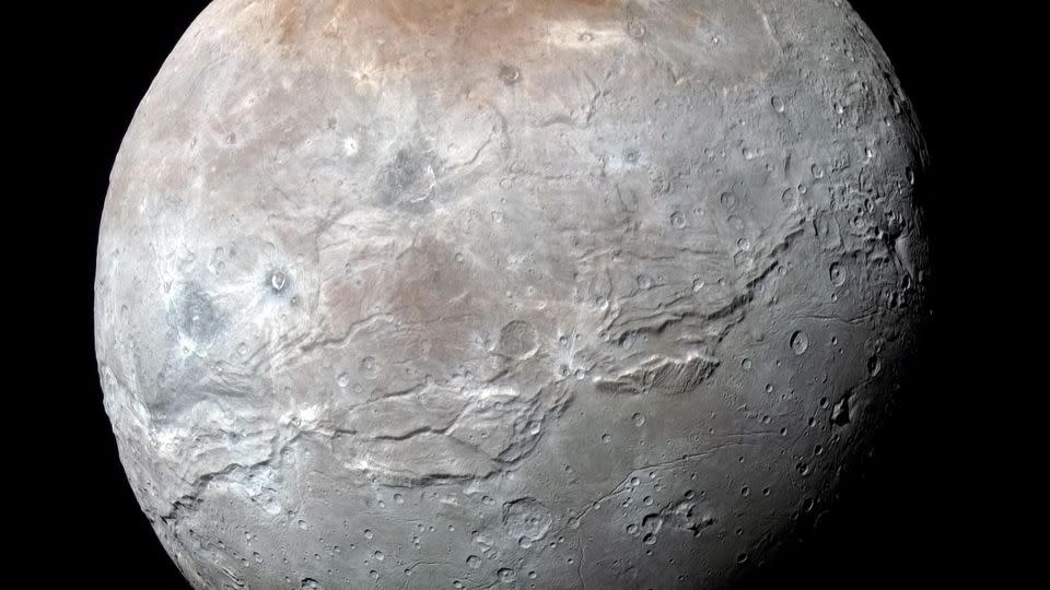 How did Pluto’s large moon Charon form? With a ‘kiss,’ scientists say