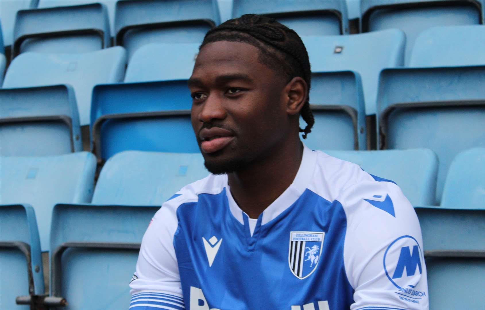 Gillingham have signed Bolton Wanderers midfielder Nelson Khumbeni for an undisclosed fee