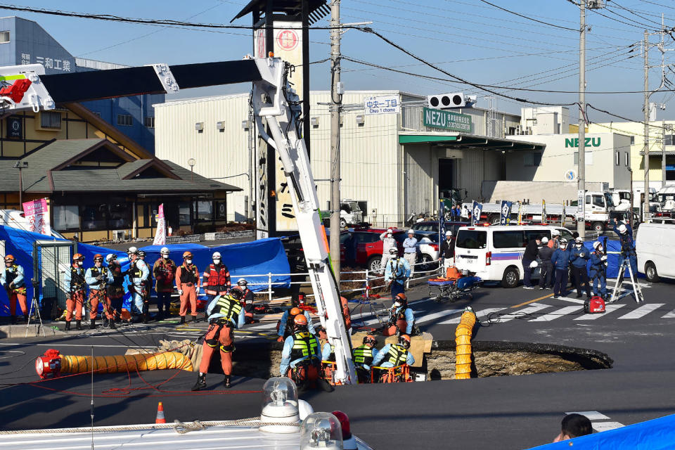 Swimming pool-sized sinkhole swallows truck in Japan, trapping driver inside