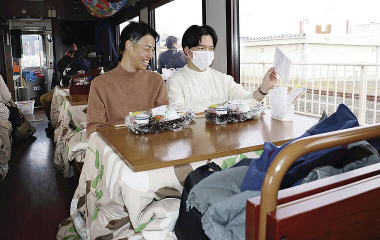 Passengers enjoy a warm, cozy train ride for the winter