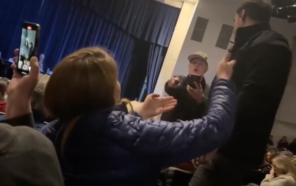 Idaho Republican town hall meeting descends into chaos after private security guards forcibly remove heckling woman