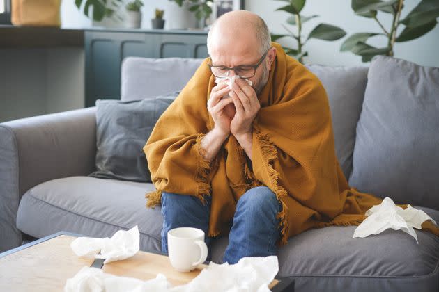 The Most Common COVID Symptoms Doctors Are Seeing In Winter 2025