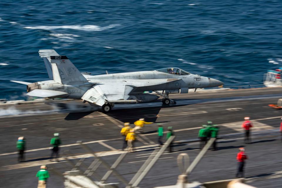 A US Navy pilot narrowly avoided crashing into the sea by as little as 16 feet after a 'catastrophic' failure aboard his aircraft carrier