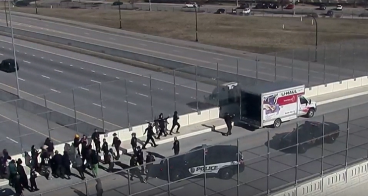 Group displaying swastika flags seen on Interstate 75 overpass near Evendale